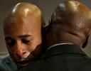 Sherwood Howard, left, cries as he hugs Nevada state Senator Kelvin Atkinson